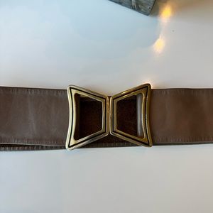 Beautiful vintage, brown leather belt, with thick gold clasp belt is adjustable.